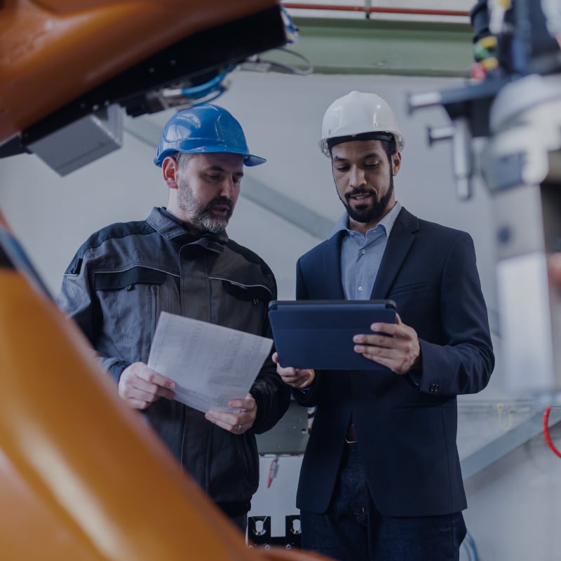 Employees of a company reviewing production costs.