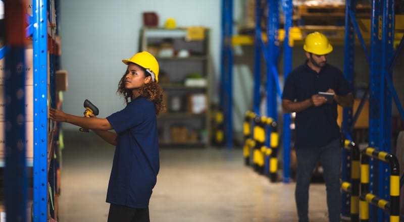 Warehouse employees managing inventory.